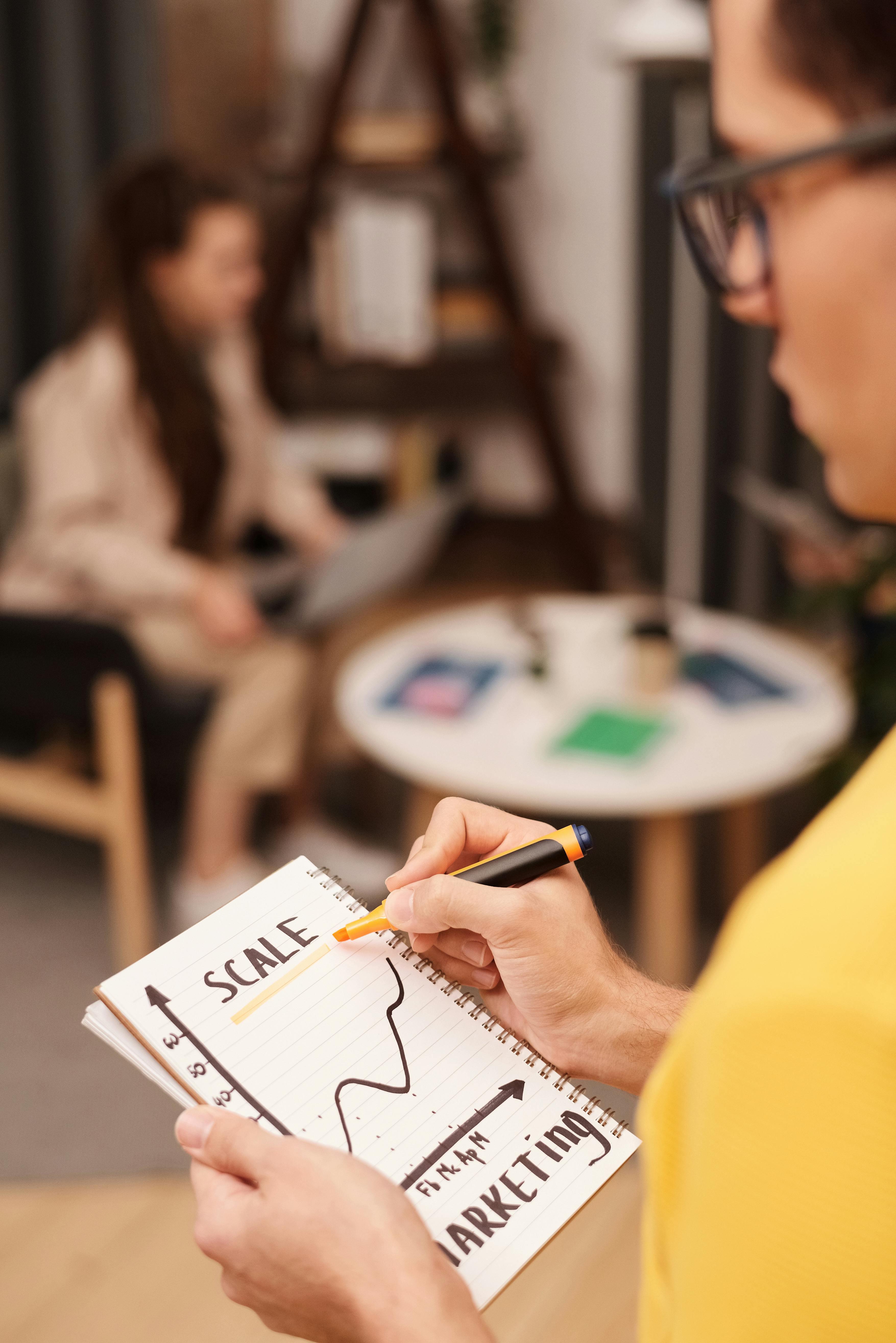 Man drawing on a notepad